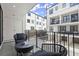 Spacious balcony with stylish furniture and views of the neighborhood at 201 New St # 2301, Decatur, GA 30030