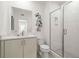 Sleek bathroom featuring a glass-enclosed shower, floating vanity, and geometric decor at 201 New St # 2301, Decatur, GA 30030