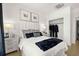 Inviting bedroom with decor, fluffy throw blanket, two windows, and ample closet space at 201 New St # 2301, Decatur, GA 30030
