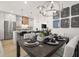 Open-concept dining room with a stylish table setting and modern decorations at 201 New St # 2301, Decatur, GA 30030