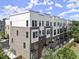Beautiful exterior view of new townhomes with brick and modern white accents at 201 New St # 2301, Decatur, GA 30030