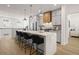 Bright kitchen featuring a large island, modern cabinetry, and hardwood floors at 201 New St # 2301, Decatur, GA 30030