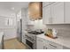 Well-equipped kitchen with stainless steel appliances and stylish cabinetry at 201 New St # 2301, Decatur, GA 30030