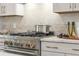 Gas range stove with granite countertops and stainless steel appliances, cooking made easy at 201 New St # 2301, Decatur, GA 30030