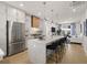 Spacious open kitchen with stainless steel appliances and a large marble island at 201 New St # 2301, Decatur, GA 30030