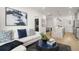 Elegant living room blending seamlessly with a modern kitchen, offering a stylish, open layout at 201 New St # 2301, Decatur, GA 30030