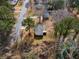 Aerial view of a home's exterior with green deck, driveway, and lawn at 3063 Kerr Dr, Decatur, GA 30034