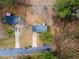 Overhead view of a house with a gray roof, driveway, and tree-filled surroundings at 3063 Kerr Dr, Decatur, GA 30034