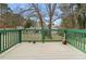 Wooden back deck with view of trees and other houses in the background at 3063 Kerr Dr, Decatur, GA 30034