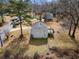 A home's back exterior has a green deck, some trees, and is in a residential neighborhood at 3063 Kerr Dr, Decatur, GA 30034