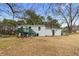 Backyard with wooden deck, stairs, and green door to the home at 3063 Kerr Dr, Decatur, GA 30034