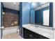 Bathroom featuring stylish sink, cabinets, bathtub with shower, and decor at 3063 Kerr Dr, Decatur, GA 30034