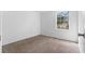 Bedroom with a large window offering ample natural light, plus clean walls and carpet at 3063 Kerr Dr, Decatur, GA 30034