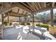 Community pavilion with picnic tables, stone columns, and an open beamed roof at 3503 Great Sky Pkwy, Canton, GA 30114