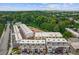 An aerial view showcases a modern townhome community with lush landscaping and convenient street parking at 201 New St # 2305-1, Decatur, GA 30030