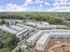 Aerial view of a new construction residential community, nestled among mature trees and manicured landscaping at 201 New St # 2305-1, Decatur, GA 30030