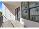 Outdoor balcony with black metal railing and view of the surrounding buildings at 201 New St # 2305-1, Decatur, GA 30030