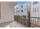 Balcony with views of the surrounding apartments and black metal railings at 201 New St # 2305-1, Decatur, GA 30030