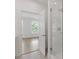 Ensuite bathroom with a glass shower and view to the bedroom at 201 New St # 2305-1, Decatur, GA 30030