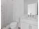 Bathroom with a glass enclosed shower and a single sink vanity with white cabinets at 201 New St # 2305-1, Decatur, GA 30030
