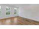 Bedroom with hardwood floors and a view of the trees outside at 201 New St # 2305-1, Decatur, GA 30030