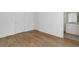 Bedroom with hardwood floors and an ensuite bathroom featuring a single sink vanity at 201 New St # 2305-1, Decatur, GA 30030