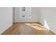 Bright bedroom with light hardwood floors, a large window, and natural light at 201 New St # 2305-1, Decatur, GA 30030