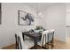 Elegant dining area featuring stylish decor, modern chandelier, and a well-set table for an intimate meal at 201 New St # 2305-1, Decatur, GA 30030