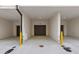Two car garage in a home with doors leading into the house on either side at 201 New St # 2305-1, Decatur, GA 30030