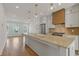 Spacious kitchen with a large island, modern appliances, and pendant lighting at 201 New St # 2305-1, Decatur, GA 30030