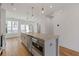 Well-lit kitchen island with stainless steel appliances, and ample natural light at 201 New St # 2305-1, Decatur, GA 30030