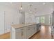 Bright kitchen with a large island, stainless steel appliances, and open floor plan at 201 New St # 2305-1, Decatur, GA 30030