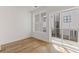 Bright room with hardwood floors and a sliding glass door to a balcony at 201 New St # 2305-1, Decatur, GA 30030