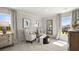 Bright bedroom featuring sitting area, large windows, neutral tones, and ample natural light at 3730 Near Star Ln, Cumming, GA 30028