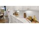 Beautiful butler's pantry with white cabinets, elegant decor, and ample counter space at 3730 Near Star Ln, Cumming, GA 30028