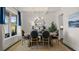 Bright dining room featuring coffered ceiling, large window, and chic decor at 3730 Near Star Ln, Cumming, GA 30028