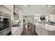 Open-concept kitchen with an island, stainless steel appliances, and seamless access to living spaces at 3730 Near Star Ln, Cumming, GA 30028