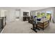 Spacious living room featuring large windows, comfortable seating, and neutral decor at 3730 Near Star Ln, Cumming, GA 30028
