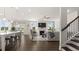 Bright, open-concept living room featuring a fireplace, hardwood floors, and abundant natural light at 3730 Near Star Ln, Cumming, GA 30028