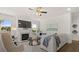 A spacious living room with a fireplace, comfortable seating, and neutral decor at 3730 Near Star Ln, Cumming, GA 30028