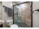 Stylish bathroom featuring a glass-enclosed shower with stone tile at 845 Spring Nw St # 322, Atlanta, GA 30308