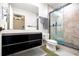 Stylish bathroom featuring a modern vanity and a glass-enclosed shower at 845 Spring Nw St # 322, Atlanta, GA 30308