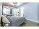 A bright bedroom featuring mirrorred closet doors and modern lighting at 845 Spring Nw St # 322, Atlanta, GA 30308