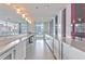 Contemporary kitchen with white cabinets, stainless steel appliances, and counter space with views of the city at 845 Spring Nw St # 322, Atlanta, GA 30308