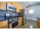 Modern kitchen featuring stainless steel appliances, gas range, and stylish backsplash at 845 Spring Nw St # 322, Atlanta, GA 30308