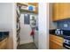 A well-organized laundry room with storage shelves and modern appliances at 845 Spring Nw St # 322, Atlanta, GA 30308