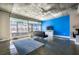Modern living room featuring polished concrete floors, a bright blue accent wall, and large windows at 845 Spring Nw St # 322, Atlanta, GA 30308