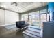 Sunlit living room with concrete floors, large windows offering city views, and a modern sofa at 845 Spring Nw St # 322, Atlanta, GA 30308