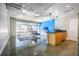 Sunlit living room with large windows, concrete floors, and an open layout leading to the kitchen at 845 Spring Nw St # 322, Atlanta, GA 30308