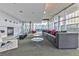 Relaxing lounge featuring comfortable seating, a fireplace, and floor-to-ceiling windows with city views at 845 Spring Nw St # 322, Atlanta, GA 30308